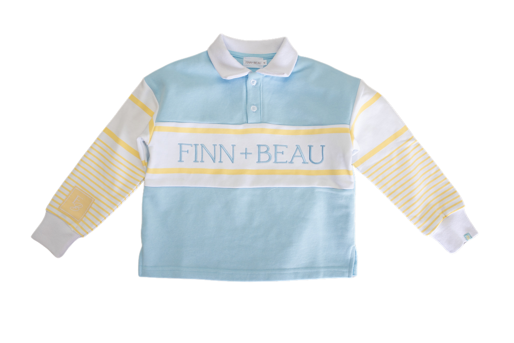 Children's light blue rugby shirt with yellow stripes and 'FINN + BEAU' branding on a white background