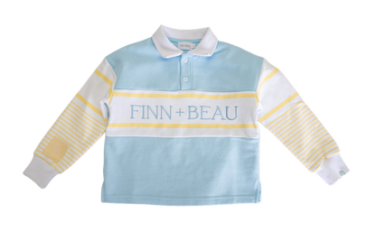 Children's light blue rugby shirt with yellow stripes and 'FINN + BEAU' branding on a white background