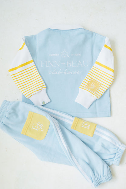 Children's light blue and yellow outfit with 'FINN + BEAU' branding on a white background